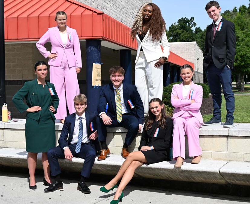 Group of students posing outside a building at the National Tournament