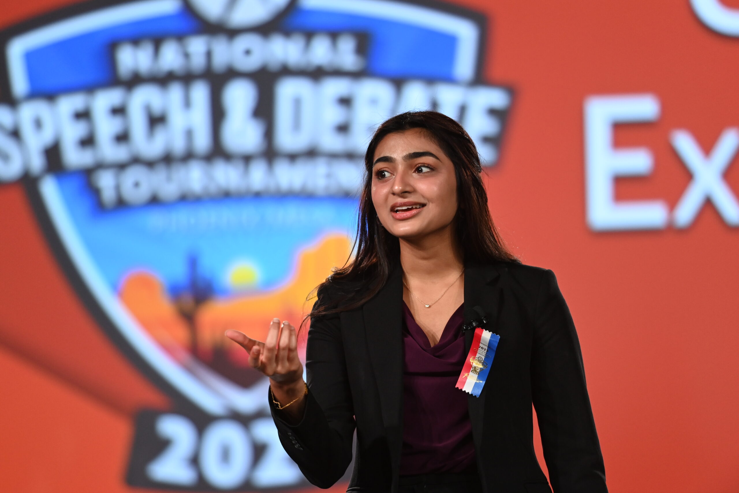 Student speaking on stage at the National Tournament Student speaking on stage at the National Tournament