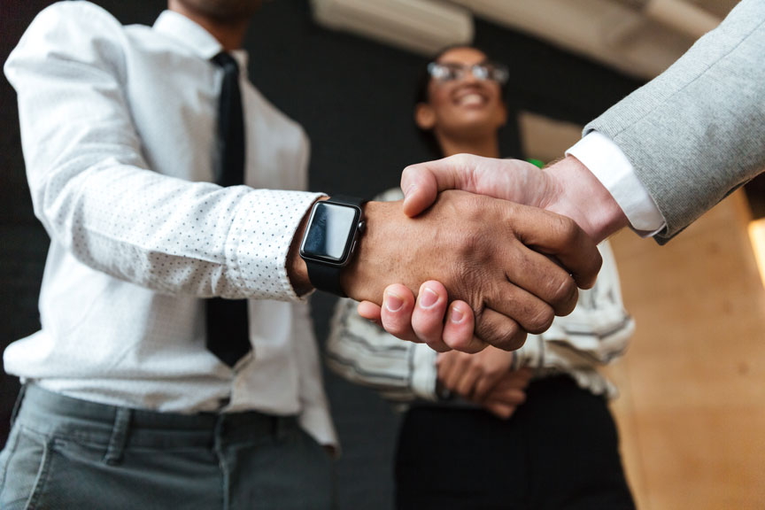 Two people shaking hands Two people shaking hands