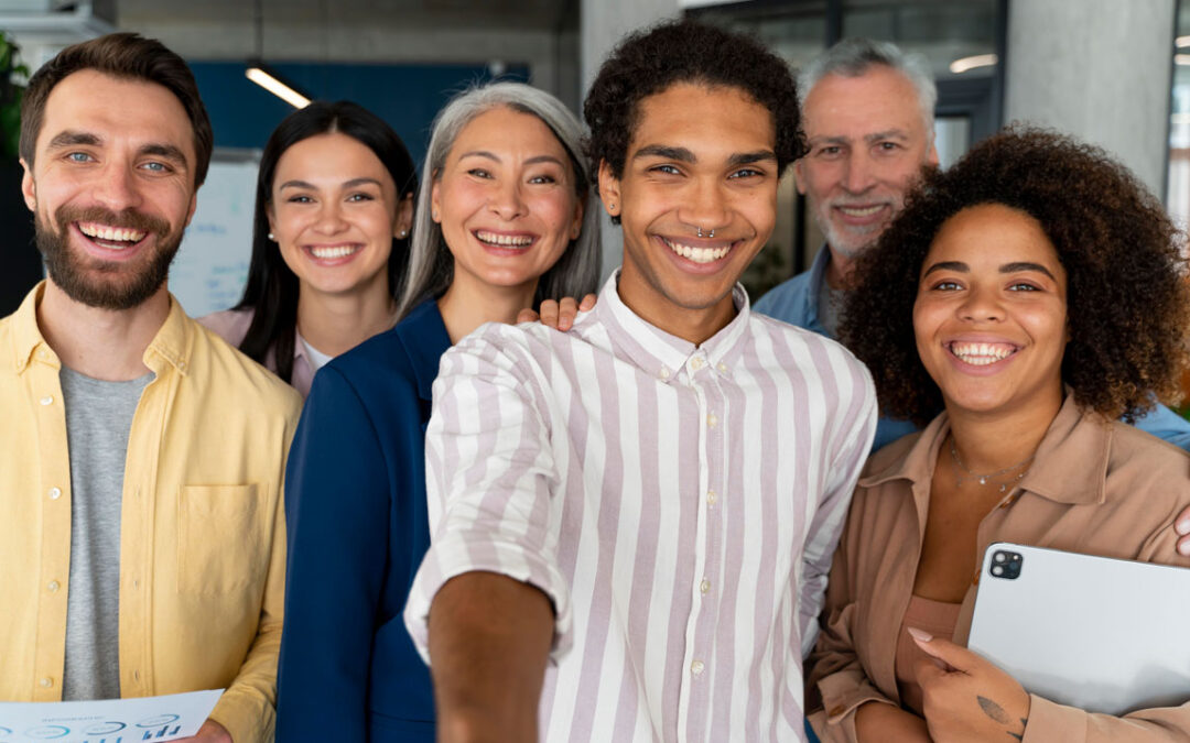 Group of people standing together looking at the camera smiling