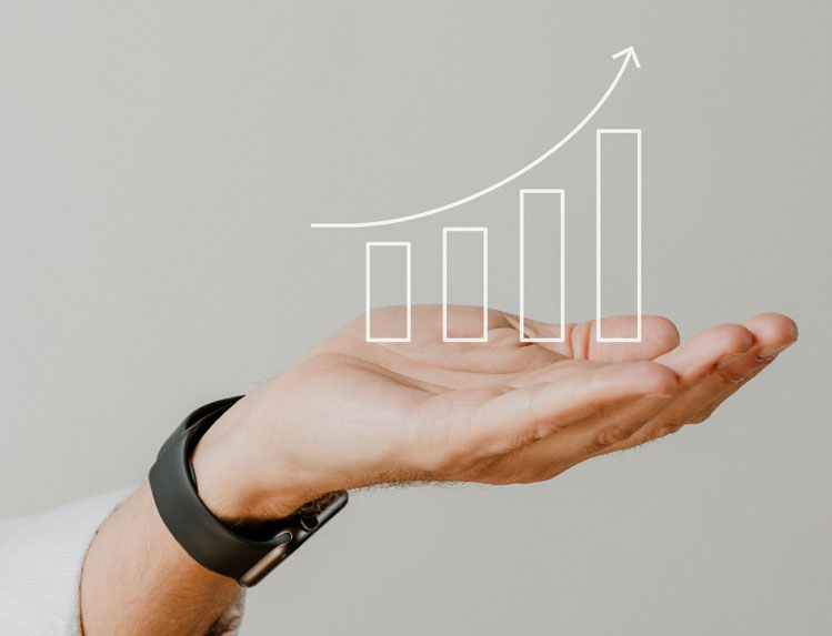 Hand holding a digital graph trending upwards Hand holding a digital graph trending upwards