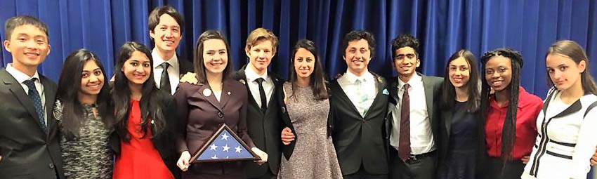 Group of USA debate alumni standing together. Group of USA debate alumni standing together.
