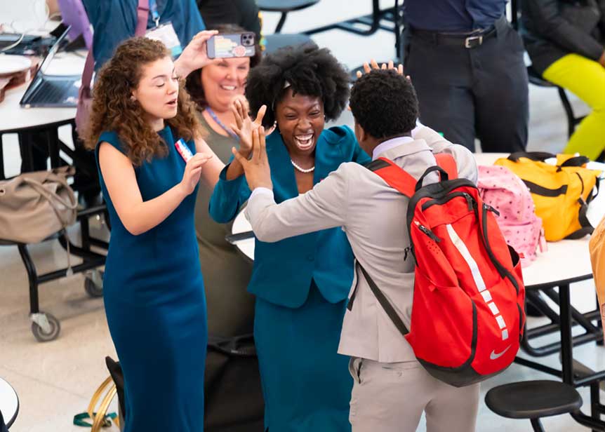 Group of students celebrating together at the National Tournament