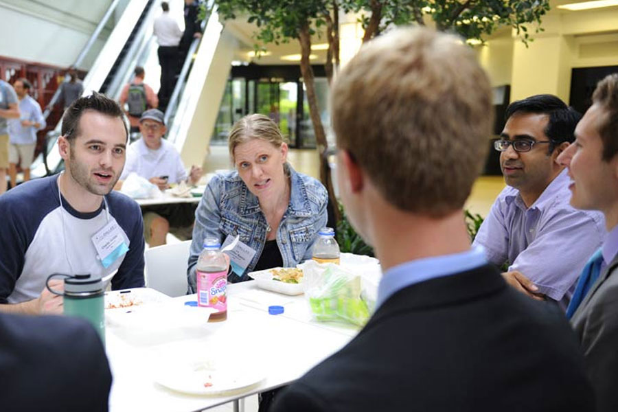 Group of people having a discussion over lunch