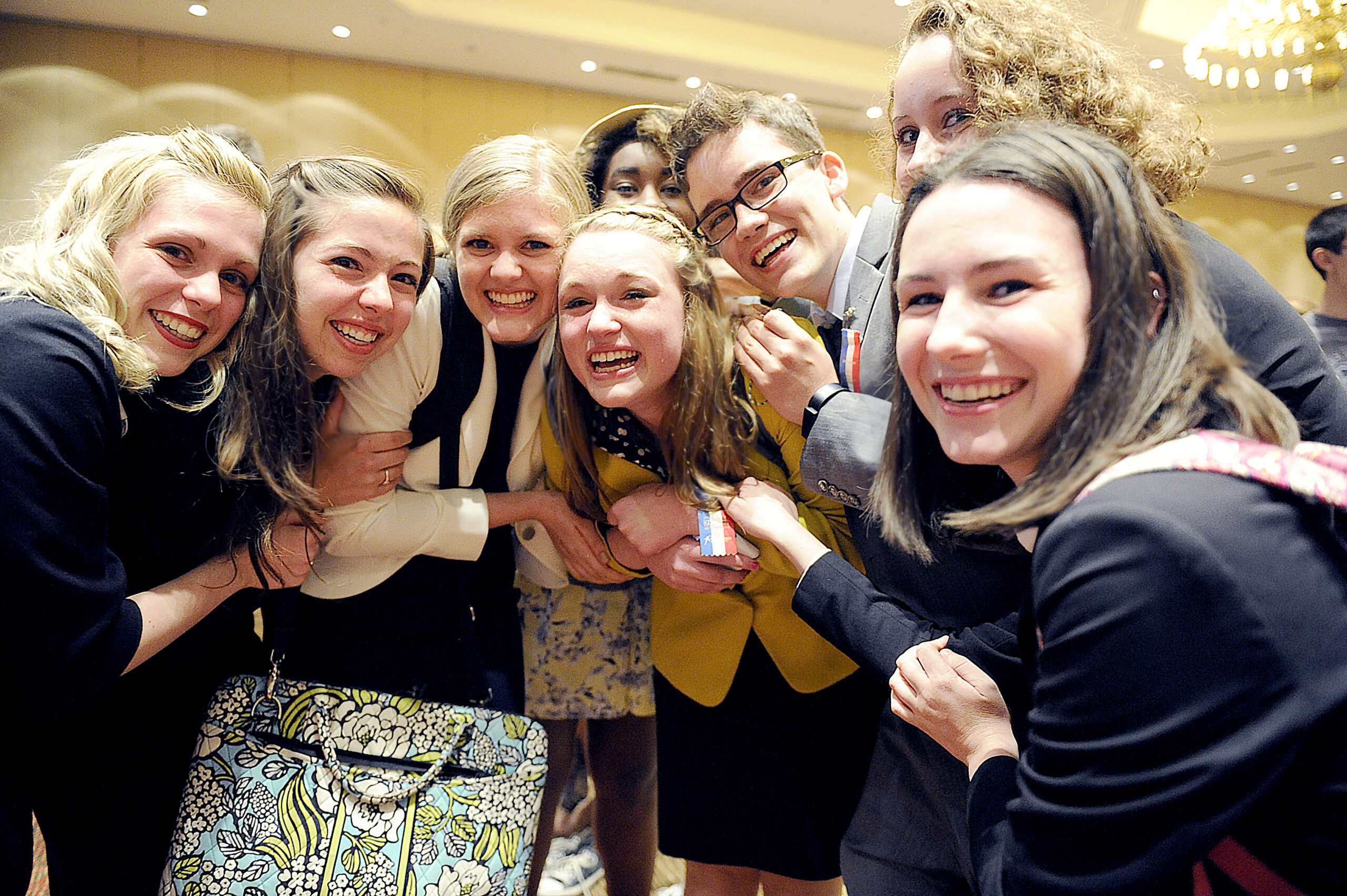 Group of students gathered close together at a competition