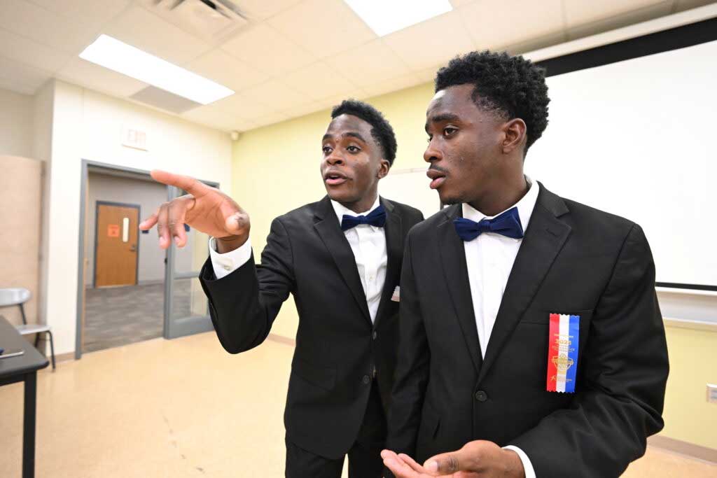 Two student performing in a classroom at a speech at a tournament