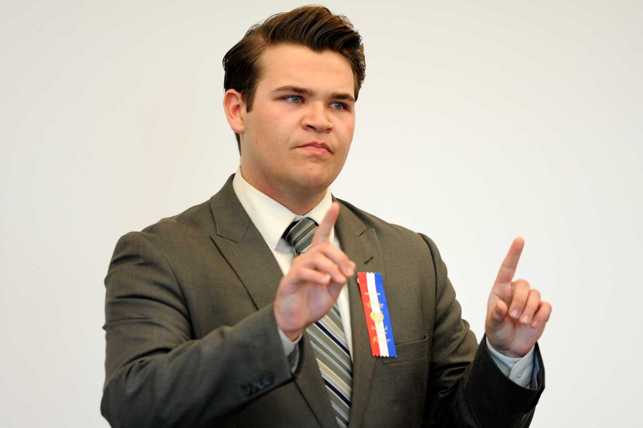 Student performing and gesturing with their hands