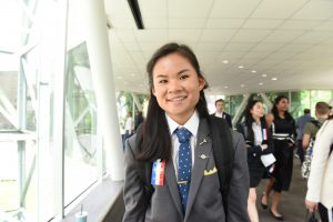 Student posing for photo in hallway