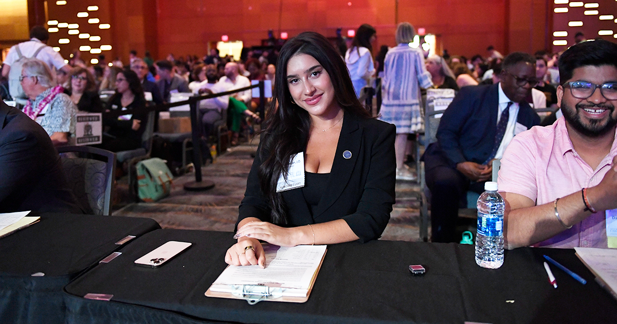 Content creator, Dellara, posing for a picture as a judge at the National Tournament.