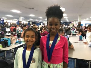 Abby and Alana with their medals.