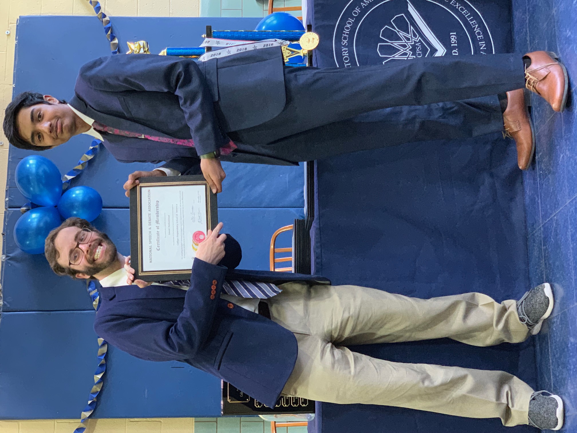 Student becoming new members of the Honor Society posing with their certificate