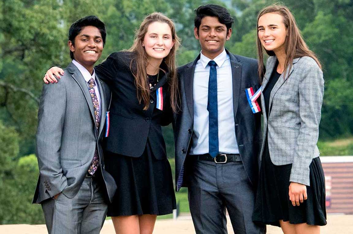 Group of students standing together smiling at the National Tournament Group of students standing together smiling at the National Tournament