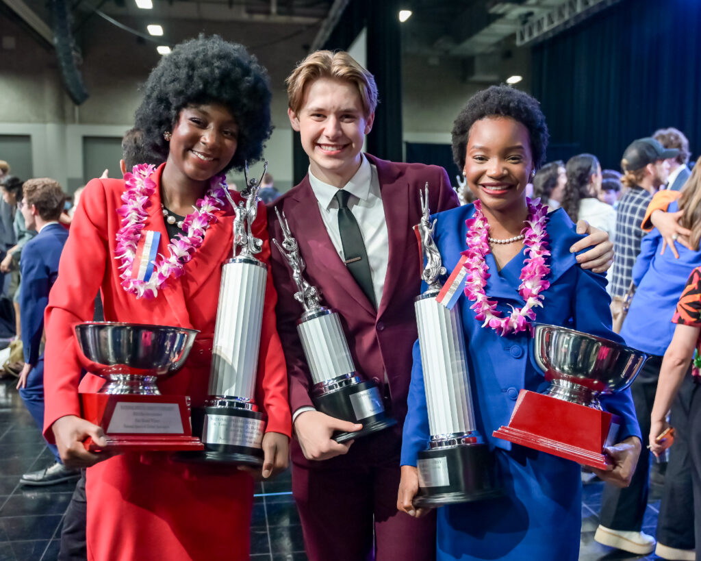 Students with their trophies at the National Tournament