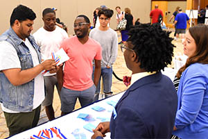 Students talking at a tournament Students talking at a tournament