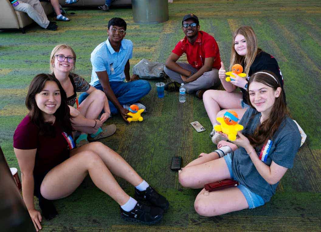 Group of students posing for a photo at a tournament