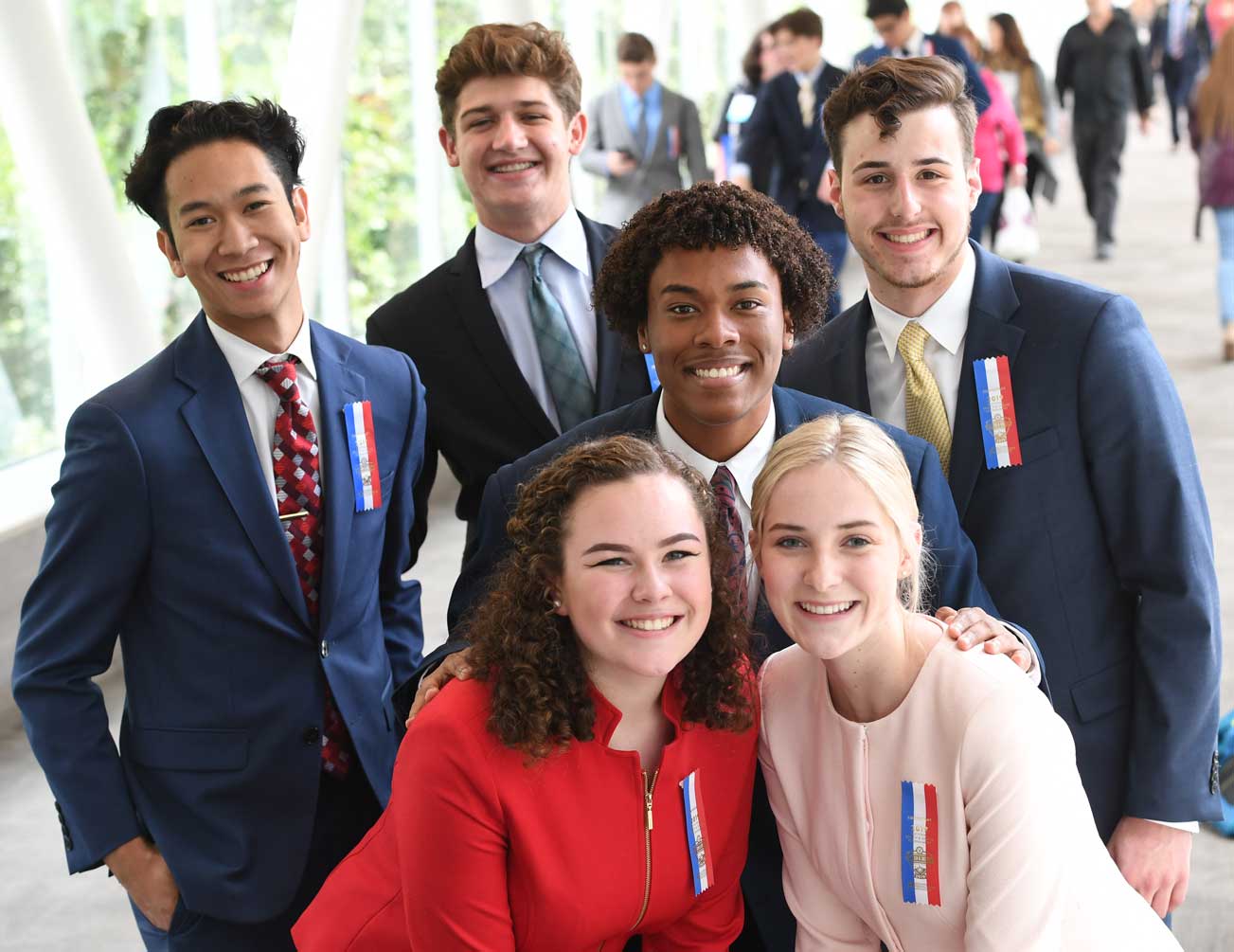 Group of students dressed up posing together at Nationals