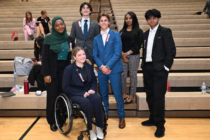 Group of students posing together in a gym