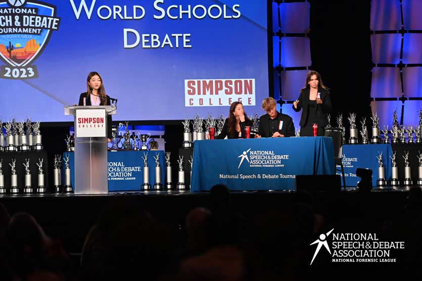 Group of students competing on the National Tournament stage. Group of students competing on the National Tournament stage.