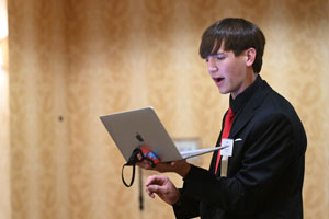 Person speaking at a podium